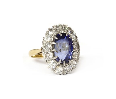Lot 199 - A sapphire and diamond oval cluster ring
