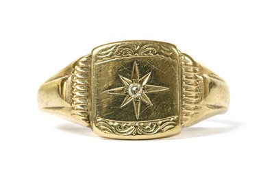 Lot 1283 - A 9ct gold diamond set signet ring