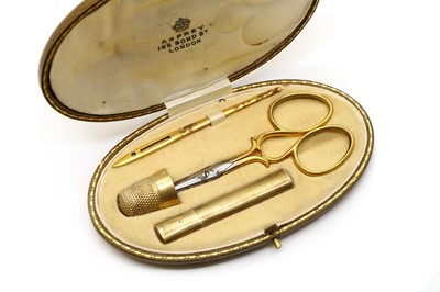 Lot 67 - An Edwardian silver gilt sewing etui