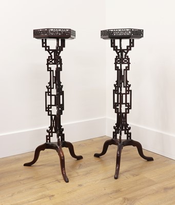 Lot 221 - A pair of Chippendale Revival torchères