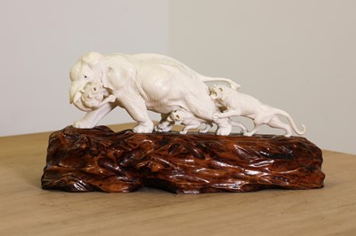 Lot 179 - A Japanese carved ivory elephant and lion group