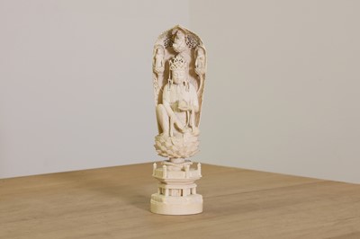 Lot 174 - A Japanese solid carved ivory figure of Kannon Bosatsu