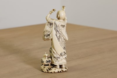 Lot 166 - A Japanese carved ivory okimono