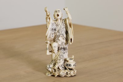 Lot 166 - A Japanese carved ivory okimono