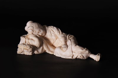Lot 161 - A Japanese carved ivory figure of a lady asleep