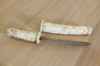 Lot 181 - A Japanese carved ivory short sword