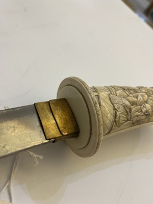 Lot 181 - A Japanese carved ivory short sword