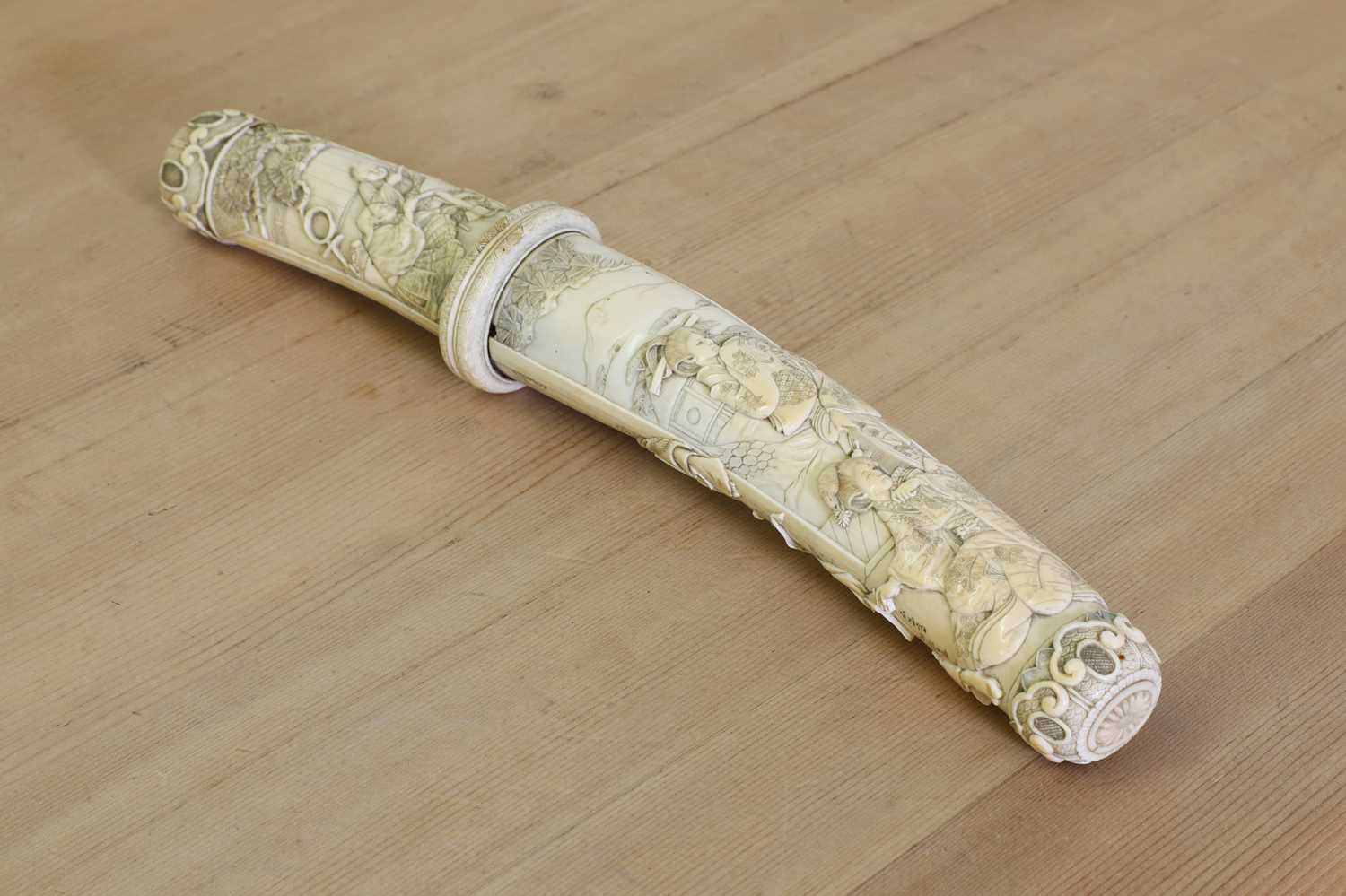 Lot 181 - A Japanese carved ivory short sword