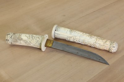 Lot 181 - A Japanese carved ivory short sword