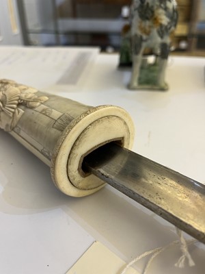 Lot 181 - A Japanese carved ivory short sword