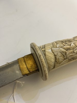 Lot 181 - A Japanese carved ivory short sword