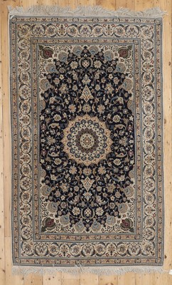 Lot 286 - A Persian wool and silk rug