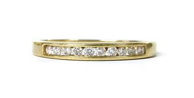Lot 1105 - An 18ct gold diamond half eternity ring