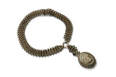 Lot 1040 - A Victorian silver locket and collar
