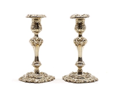 Lot 30 - A pair of George III silver candlesticks