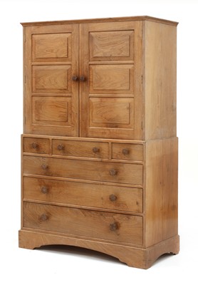 Lot 230 - A Cotswold School walnut linen press