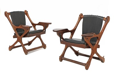 Lot 500 - A pair of cocobolo wood and leather armchairs