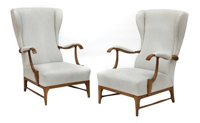 Lot 411 - A pair of walnut and upholstered wingbacked armchairs