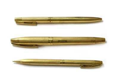 Lot 1355 - An 18ct gold three piece pen and pencil set, by Sheaffer