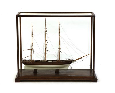 Lot 323 - A wooden ship model in glass case