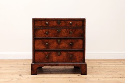Lot 121 - A small George I-style walnut chest of drawers