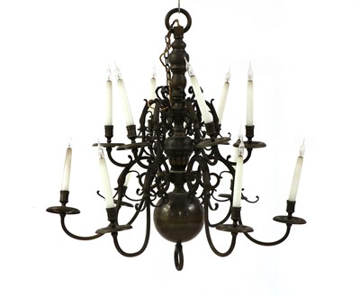 Lot 551 - A Dutch style brass twelve-branch electrolier
