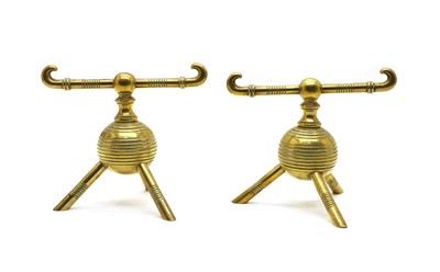 Lot 154 - A pair of brass firedogs designed by Christopher Dresser