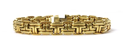 Lot 1074 - An 18ct gold necklace and bracelet suite, by Garrard