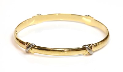 Lot 520 - A Cartier three colour gold 'Trinity' bangle