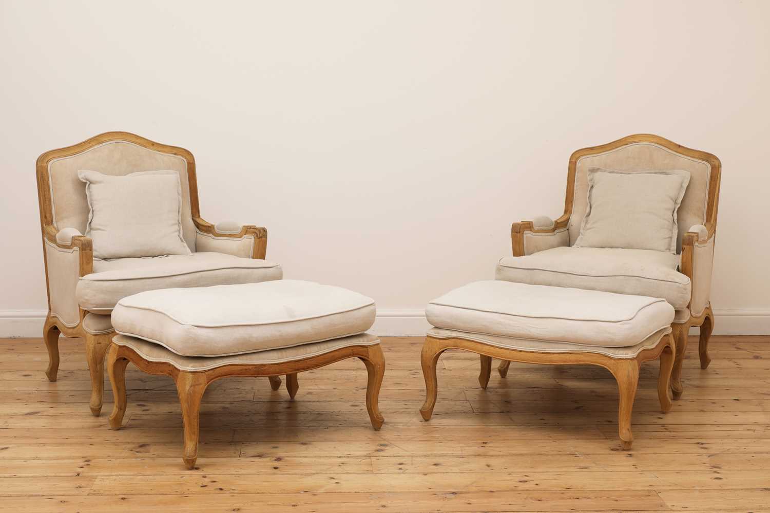 Lot 490 - A pair of blonde oak fauteuils