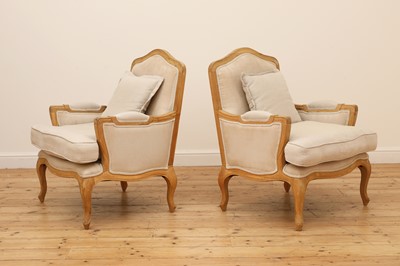 Lot 490 - A pair of blonde oak fauteuils