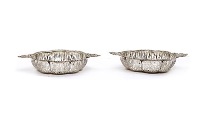 Lot 71 - A pair of pierced twin handled silver bon bon dishes