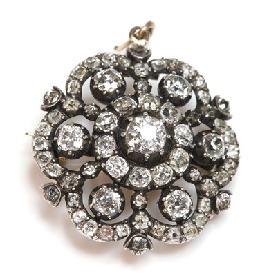 Lot 60 - A late Georgian hexafoil shaped diamond set target cluster