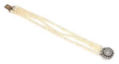 Lot 151 - A three row pearl bracelet