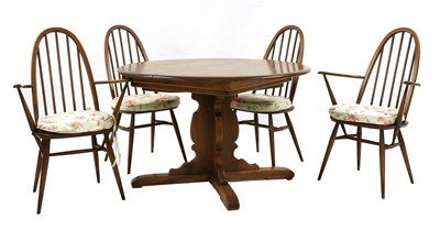 Lot 302 - A mid-20th century Ercol elm and beech wood dining suite