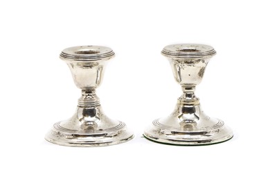 Lot 19 - A pair of dwarf silver candlesticks
