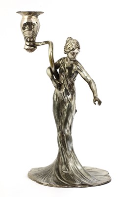 Lot 104 - A WMF silvered pewter figural candlestick