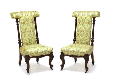 Lot 414 - A pair of Victorian walnut prieu dieu