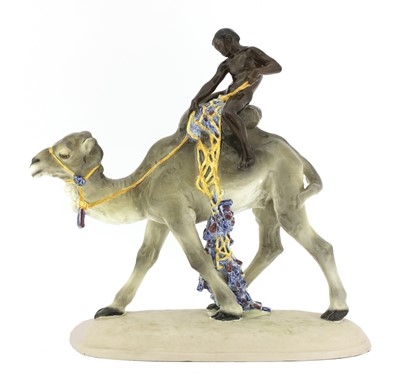 Lot 79 - A Goldscheider pottery group of a boy on a camel