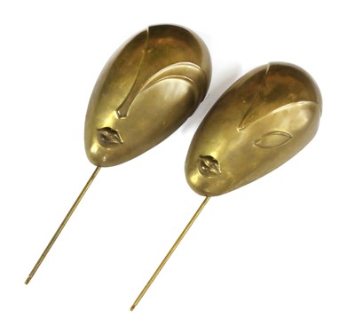 Lot 327 - A pair of Hagenauer-style brass masks