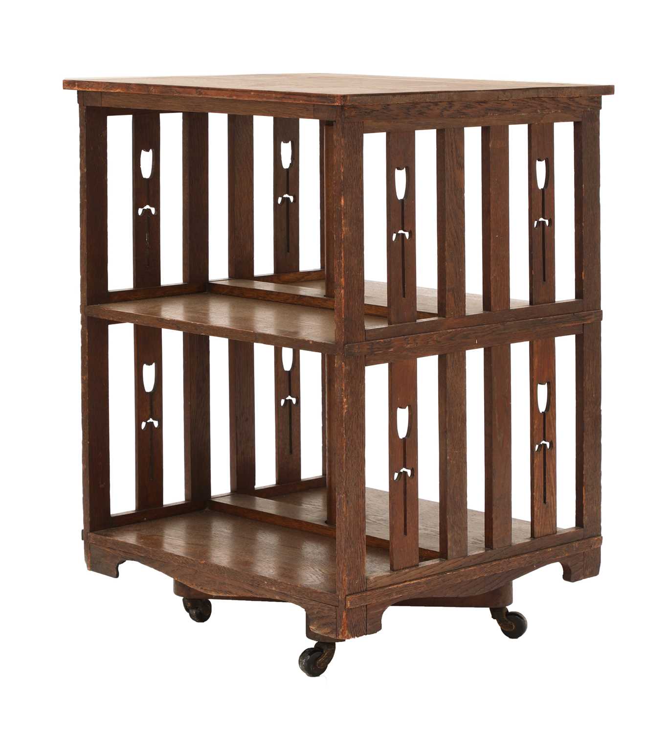 Lot 190 - An oak revolving bookcase