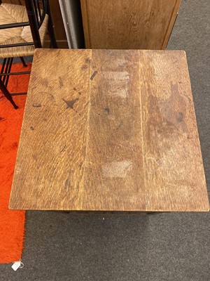 Lot 190 - An oak revolving bookcase