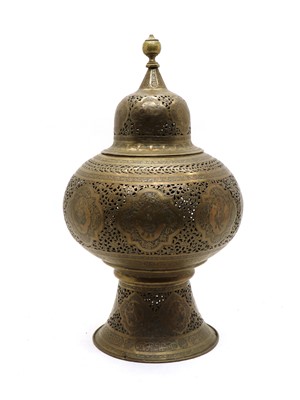 Lot 202 - A Persian pierced and engraved brass mosque lantern