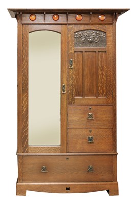 Lot 146 - An Arts and Crafts oak wardrobe