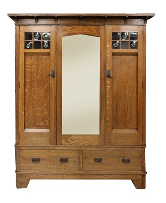 Lot 153 - An Arts and Crafts oak wardrobe