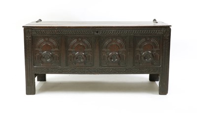 Lot 496 - A carved oak coffer