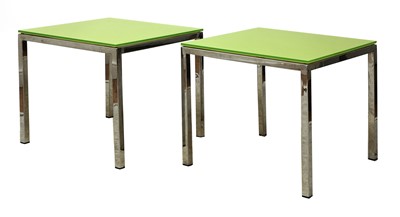 Lot 581 - A pair of chrome and glass side tables