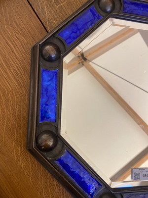 Lot 154 - An Arts and Crafts cast bronze octagonal mirror