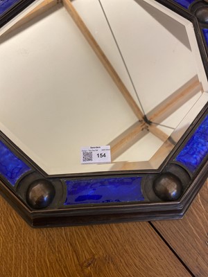Lot 154 - An Arts and Crafts cast bronze octagonal mirror