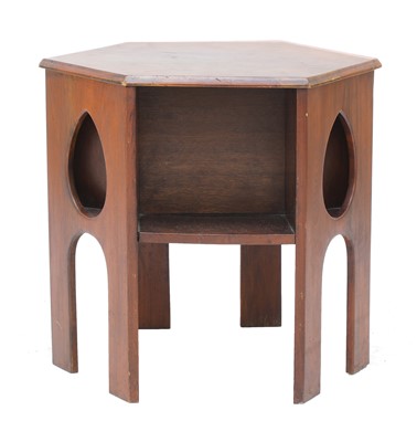 Lot 147 - A Liberty walnut hexagonal book table